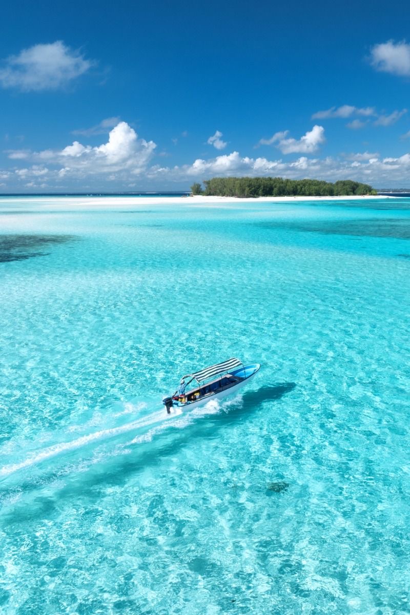 The Island Code – Zanzibar turquoise sea and boat